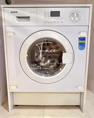 a white washing machine with a sign written on it at Face Malaysia Tallest Tower 118 in Kuala Lumpur in Kuala Lumpur