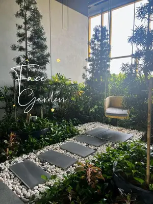 a garden with rocks and plants and a sign that reads tree garden at Face Malaysia Tallest Tower 118 in Kuala Lumpur in Kuala Lumpur