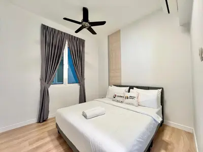 a bedroom with a bed with a ceiling fan at Court 28 Residence KL Suites 2 Bedroom Apartment by Sleepy Bear in Kuala Lumpur