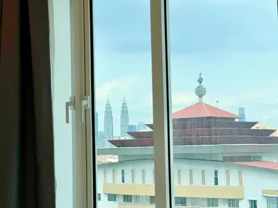 a view of a city from a window at Court 28 Residence KL Suites 2 Bedroom Apartment by Sleepy Bear in Kuala Lumpur