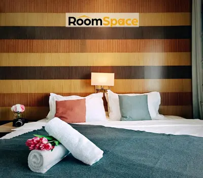 a bedroom with a bed with a room space sign on it at D'Majestic Place Jalan Pudu in Kuala Lumpur