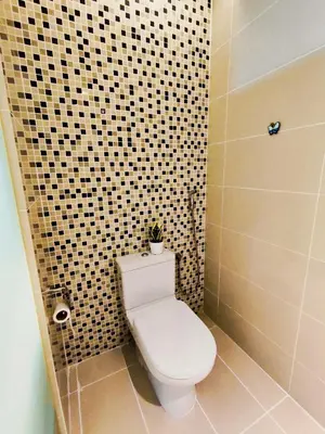 a bathroom with a toilet with a plant on top of it at D'Majestic Place Jalan Pudu in Kuala Lumpur