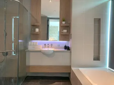 a bathroom with a sink and a shower and a tub at KL Golf Country Club Resort Villa by AnyLodge in Kuala Lumpur
