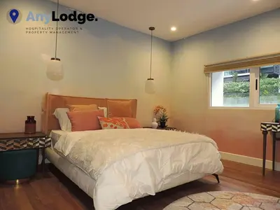 a bedroom with a large bed and a window at KL Golf Country Club Resort Villa by AnyLodge in Kuala Lumpur