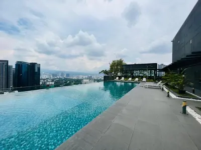 a large swimming pool on top of a building at The Dorsett Service Suites Bukit Bintang Kuala Lumpur in Kuala Lumpur