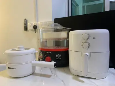 a counter with a mixer and a food processor at Corner KL Pool View RC Residence with High Internet Speed 500Mbps in Kuala Lumpur