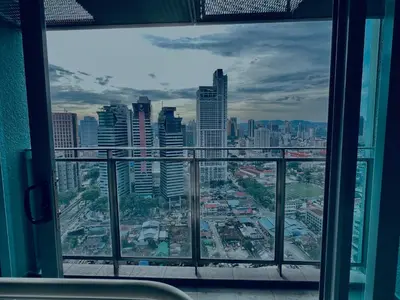 a view of a city skyline from a window at Summer suites victory house in Kuala Lumpur