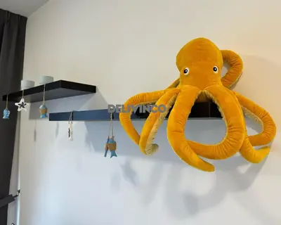 a stuffed octopus is hanging on a wall at Trion - KL - 2BR - 6pax - 15min to KLCC & TRX in Kuala Lumpur
