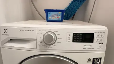a white microwave oven sitting on top of a washing machine at Extravagant Family-Biz Nest @ Robertson 30F in Kuala Lumpur