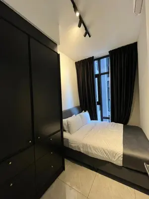 a bedroom with a bed and a large window at Bukit Bintang Axon Residences 3R2B 3Queens Beds in Kuala Lumpur