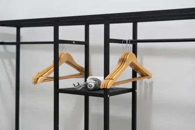 a black shelf with a pair of shoes on it at Razak City Residence by Lisa Homestay in Kuala Lumpur