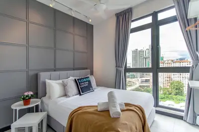 a bedroom with a bed and a large window at Neu Suites Ampang near LRT Jelatek in Kuala Lumpur
