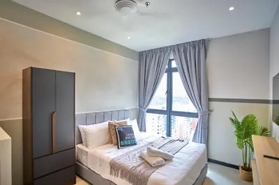 a bedroom with a bed with a large window at Neu Suites Ampang near LRT Jelatek in Kuala Lumpur