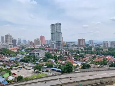 a cityscape of a city with a highway and buildings at Mercu Summer Suites KLCC 2BR Pastel Rose in Kuala Lumpur