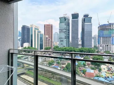 a view of a city skyline from a balcony at Mercu Summer Suites KLCC 2BR Pastel Rose in Kuala Lumpur