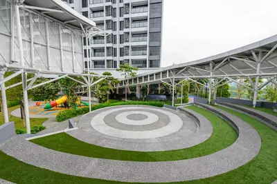 a park with a playground and a building at Trion Premier Suites Kuala Lumpur in Kuala Lumpur