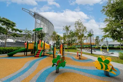 a playground at a park with a slide and slides at Trion Premier Suites Kuala Lumpur in Kuala Lumpur