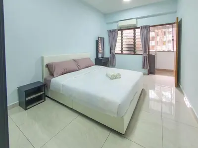 a bedroom with a large white bed and a window at Cozy Place-Rumah Nyaman - Bukit Bintang by Shine Stay in Kuala Lumpur