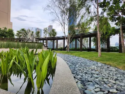 a garden with a stone path and a building at Axon Suite Bukit Bintang 3Bed Room Suites ,5min Pavillion KL in Kuala Lumpur