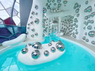 a pool of water with a bunch of silver balls at Arte plus by studio sweet home in Batu Empat