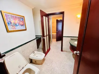 a bathroom with a toilet and a sink at Times Square Apartment By Skyline in Kuala Lumpur