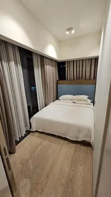 a bedroom with a large bed with white sheets at Star Residence Pool View 2br Unit Floor 8 in Kuala Lumpur