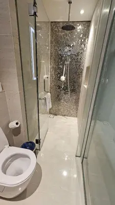 a bathroom with a toilet and a shower at Star Residence Pool View 2br Unit Floor 8 in Kuala Lumpur