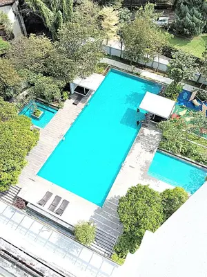 an overhead view of two large swimming pools at Suasana Suites KLCC Bukit Ceylon in Kuala Lumpur