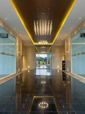 a lobby of a building with a shiny floor and a ceiling at KL Sunway Velocity 1-5pax connected to Mall & MRT in Kuala Lumpur