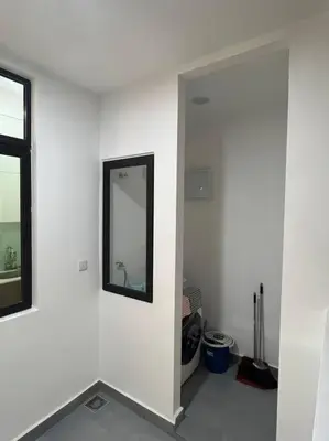 a white room with a mirror on a wall at KL Sunway Velocity 1-5pax connected to Mall & MRT in Kuala Lumpur