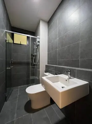 a bathroom with a sink and a toilet and a shower at KL Sunway Velocity 1-5pax connected to Mall & MRT in Kuala Lumpur