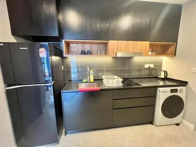 a kitchen with a black refrigerator and a dishwasher at Axon Bukit Bintang By Moonlight in Kuala Lumpur