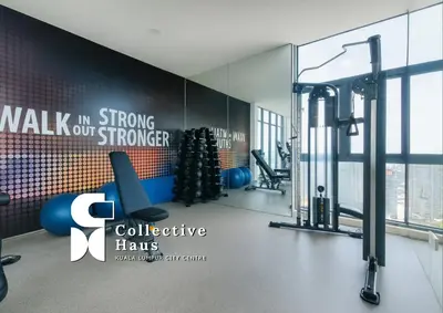 a room with a gym with a christmas tree at Royce Residence KLCC Kuala Lumpur by Collective Haus in Kuala Lumpur