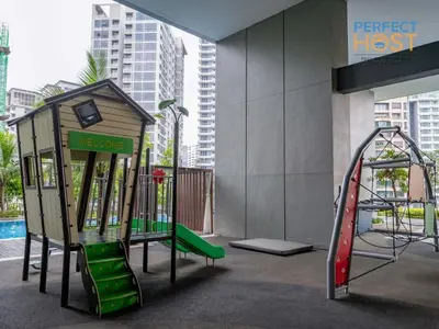 a childrens playground with a slide and a play structure at Pavilion Ceylon Hill Suites, KLCC in Kuala Lumpur