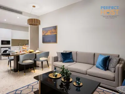 a living room with a couch and a table at Pavilion Ceylon Hill Suites, KLCC in Kuala Lumpur