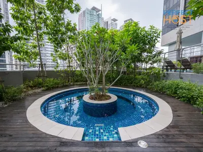 a small pool with a tree in it at Pavilion Ceylon Hill Suites, KLCC in Kuala Lumpur