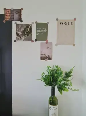 a bottle of wine with a plant in a vase at Designer Studio Arte Mont Kiara in Kuala Lumpur