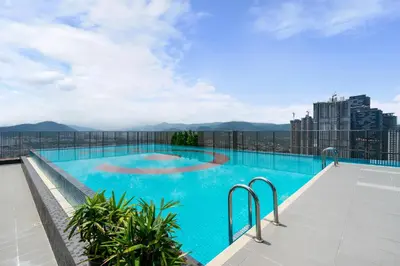 a large swimming pool on the roof of a building at 3Towers @ KL City Centre in Kuala Lumpur