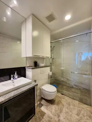 a bathroom with a toilet and a sink and a shower at The Platinum KLCC By Victoria Home in Kuala Lumpur
