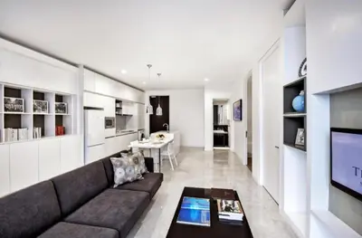 a living room with a couch and a television at The Platinum KLCC By Victoria Home in Kuala Lumpur