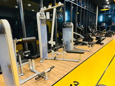 a gym with several rows of tread machines at Neu Suites Service Apartment in Kuala Lumpur