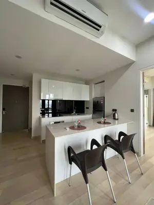 a kitchen with two chairs and a island in a room at Star Residence Klcc By M&T in Kuala Lumpur