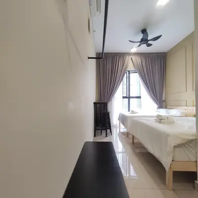a bedroom with two beds and a ceiling fan at TRION studio 4 PAX tenseven in Kuala Lumpur