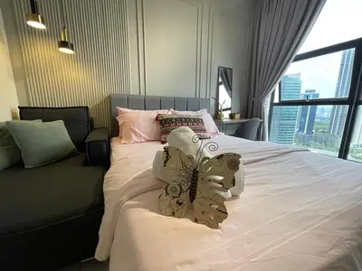 a bedroom with a large bed with a large window at Anggun Arte Mont Kiara in Kuala Lumpur