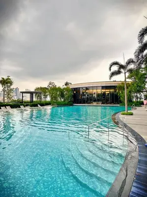 a large swimming pool in front of a building at 2R2B*1-6+1 Pax*KL City*10mins-KLCC in Kuala Lumpur