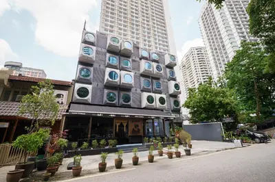 a building with a bunch of circles on it at The Mesui Hotel Bukit Bintang in Kuala Lumpur
