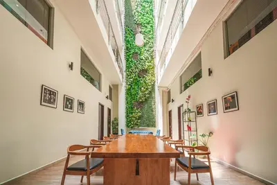 a conference room with a table and chairs in a building at The Mesui Hotel Bukit Bintang in Kuala Lumpur