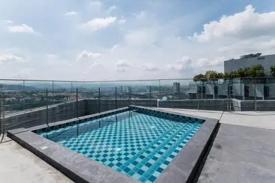 a swimming pool on the roof of a building at Duplex Industrial Loft 5pax above Eko Cheras Mall in Kuala Lumpur
