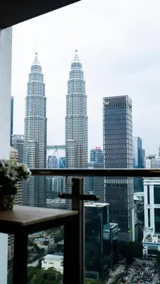 a view of a city skyline with tall buildings at Leaves @ Legasi KLCC View, Kg Baru KL in Kuala Lumpur