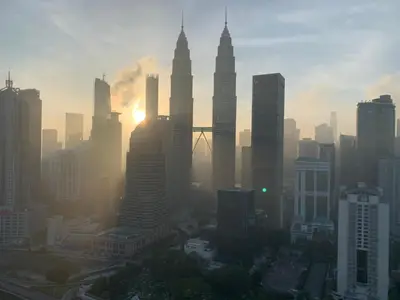 a view of a city with tall skyscrapers at Leaves @ Legasi KLCC View, Kg Baru KL in Kuala Lumpur